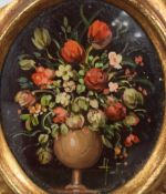 A 20th Century miniature oil on board, a still life study of an abundant vase of flowers, initialled