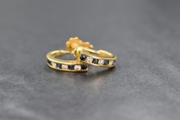 A pair of 18ct gold sapphire and diamond set screw back hoop earrings, the half hoop earrings having