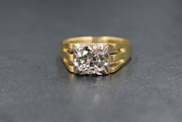 An 18ct gold diamond set signet style ring, the central round brilliant cut diamond measuring