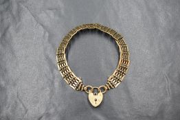A 9ct gold brick style link bracelet, with heart padlock clasp, marked 375, 14.5g