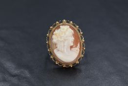 A 9ct gold cameo set ring, the cameo depicting a maiden in profile in a bezel setting with