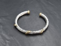A 9ct two tone gold cuff bracelet, the white gold rope motif having yellow gold detail, marked