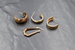 A group of odd 9ct gold and yellow metal earrings, marked 375, 2.5g