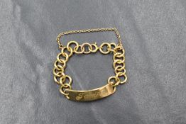 An 18ct gold child's identity bracelet, having 'James' engraved, marked 18ct, 9.3g