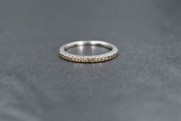 A Le Vian 14ct white gold diamond set band, having seventeen 'chocolate' diamonds, marked 14k,