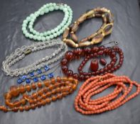 Seven strings of vintage beads and necklaces including carved coral, horn, crystal etc