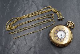 A gold plated Half Hunter top wound pocket watch having an Arabic numeral dial with subsidiary