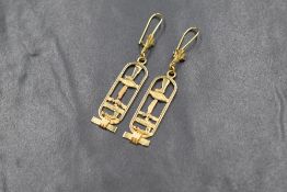 A pair of Egyptian 18ct gold hieroglyphic drop earrings, 18ct Egyptian hallmarks, 4.7g