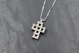 An 18ct white gold diamond set cross pendant, the openwork lattice motif cross set with round