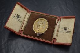 A 9ct gold 'The Confectioners Bakers and Allied Trades Exhibition London' presentation medallion,