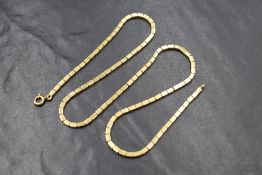 An 18ct gold fancy box link chain, having articulated rectangular links, marked 750, 47cm, 20.7g