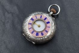 A small continental silver side wound Half Hunter pocket watch having a Roman numeral dial to