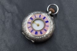 A small continental silver side wound Half Hunter pocket watch having a Roman numeral dial to