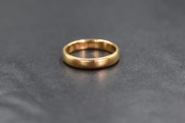 An 18ct gold wedding band of plain form, size J & 3.5g