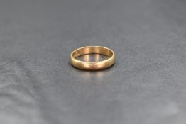 A 9ct gold wedding band of plain form, size J & 1.9g