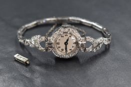 A Josarn white metal presumed platinum diamond set wristwatch, the white dial having Arabic