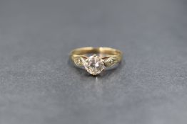A 9ct gold cubic zirconia set solitaire ring, the round brilliant cut cubic zirconia measuring