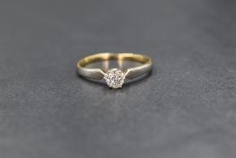 A yellow metal diamond set solitaire, the old cut diamond measuring approximately 0.25ct in a six