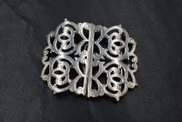 A Victorian silver nurse's buckle of pierced scroll form, hallmarked Birmingham 1899, approx 25.4g