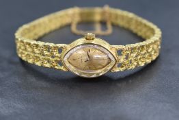 A lady's 1960/70's 18ct gold Omega manual movement cocktail watch having a baton numeral dial to