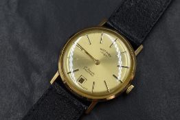 A 9ct gold Rotary wristwatch, the golden dial having baton five minute markers and date aperture