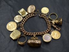 A 9ct rose gold curb link charm bracelet, having twelve charms comprising a 22ct gold band, an