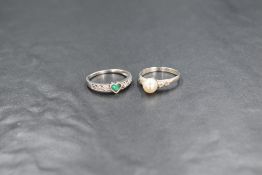 A 9ct gold pearl and diamond set ring, the central cultured pearl having two diamonds to each