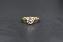 A 14ct gold diamond set solitaire ring, the round brilliant cut diamond measuring approximately 0.