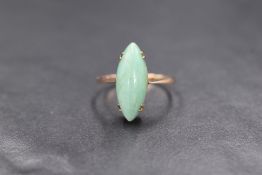 A 9ct rose gold aventurine quartz ring having a marquise cabochon stone in a raised claw set mount