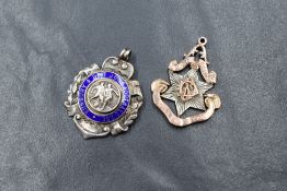 Two early/mid 20th century silver medalions, one being a football medal regarding Bunbury & District