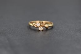 A 9ct gold three stone cubic zirconia ring, missing one stone with another damaged, in claw set