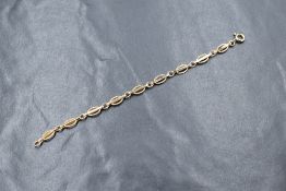 A 9ct gold fancy link child bracelet, marked 375, 1.7g
