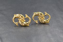 A pair of yellow metal earrings stamped 585 modelled as pairs of dolphins, for pierced ears,