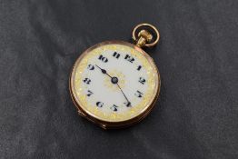 A small 9ct gold top wound pocket watch having Arabic numeral dial to white enamelled face with gilt