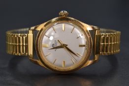 A Bucherer manual wristwatch, the champagne dial having baton five minute markers, in a stainless