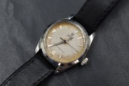 A Tudor Oyster wristwatch, the champagne dial having Arabic numerals and baton markers, in a