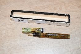 A vintage Waterman lever fill fountain pen in Green Marble with Waterman Ideal Canada nib. Clip