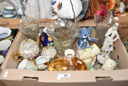 A pair of pressed glass square trumpet shaped vases and a similar round vase, an iridescent