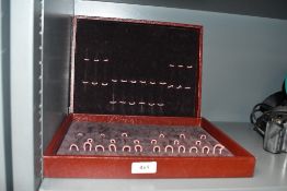 A pen collectors storage case lined in brown velvet with space for approximately 24 pens measuring