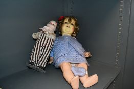 A vintage pot headed doll having a papier mache style body and a musical clown doll. Both show signs