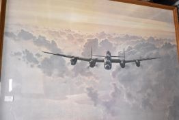 A framed print entitled Outbound Lancaster Crossing The East Coast after Gerald Coulson in a