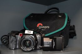 A Minolta 8700 camera with Minolta AF Zoom 35-80mm 1:4lens and 2000xl flash in soft camera bag