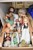 A collection of vintage dolls and teddies.