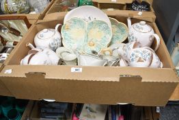A Tuscan China 'Blue Star' part tea service having a pink ground and brown and turquoise pattern (