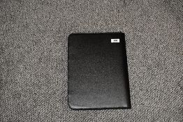 An imitation leather pen collectors folder lined in black velveteen and having space for