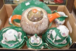 A part tea service manufactured in Bulgaria and having a delicate pink floral motif on white with