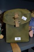 An olive green canvas military gas mask bag with handle 22cm x 19cm x 14cm would make a quirky
