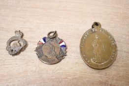 A bronze coloured oval religious medallion thought to be of French origin of St Francis Xavier, an