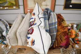 A pair of At Home In The Country rectangular cushions featuring countryside animals and birds, an