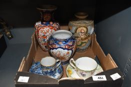 An Imari porcelain vase in blue and reds and a similar vase, a Satsuma style vase, a Royal Doulton